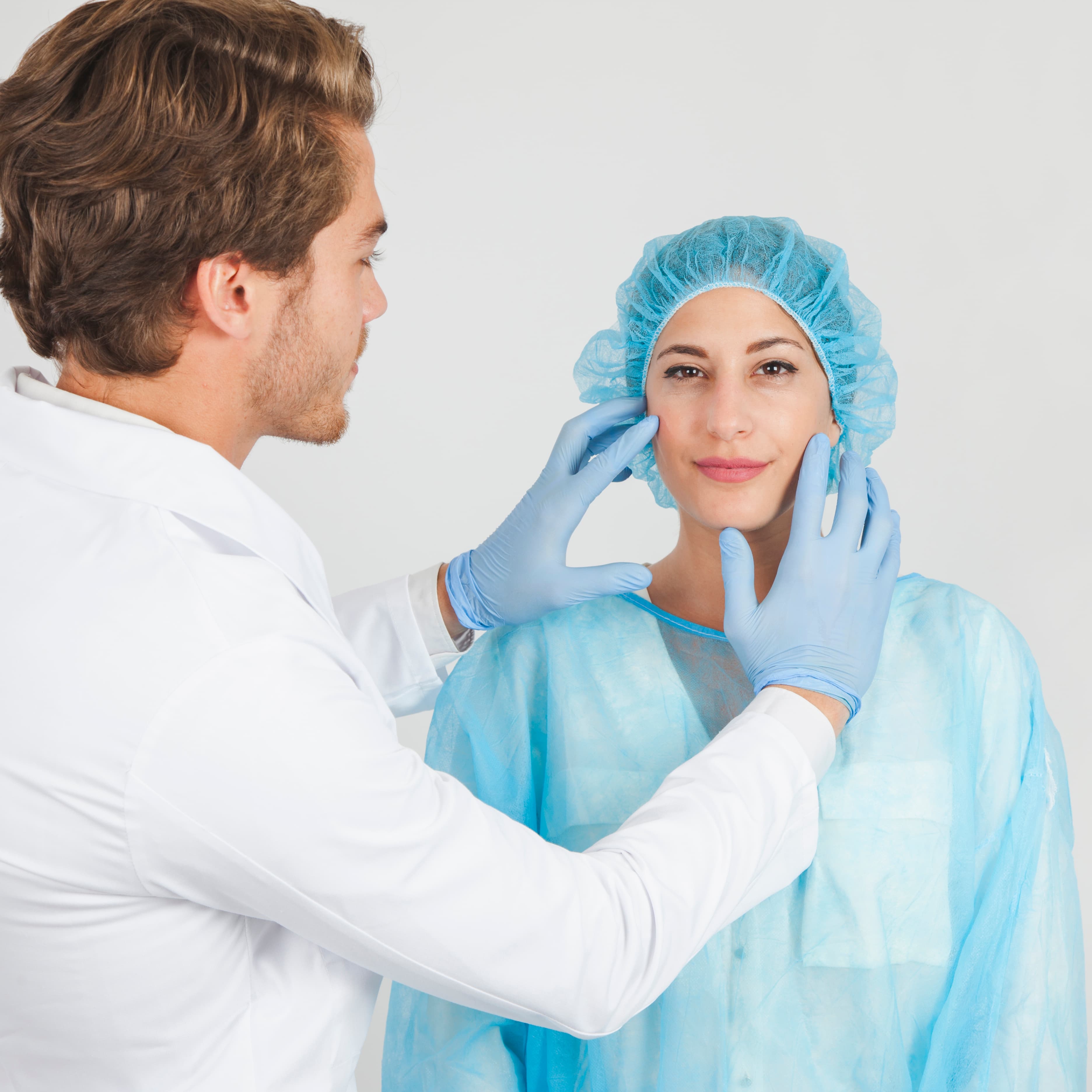 Cosmetic surgeon consulting a patient in a clinic