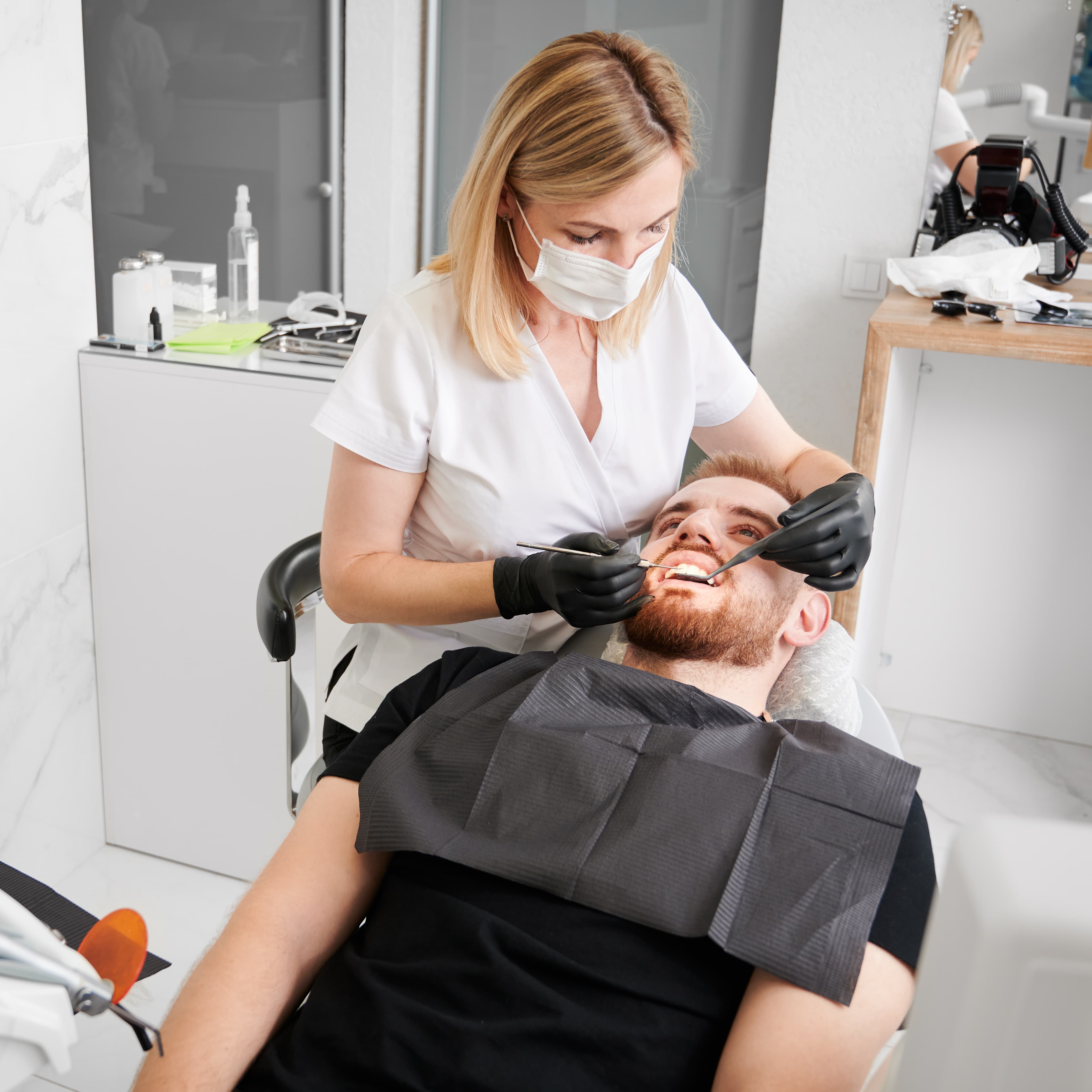 Dentist placing a dental implant using guided surgery